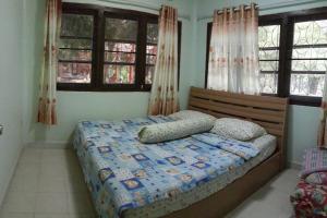 מיטה או מיטות בחדר ב-Baan Rai Pu Fa