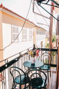 A balcony or terrace at Under the Clock Tower (Greek Traditional 125m2 home)
