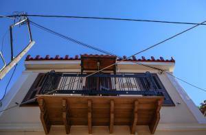 A balcony or terrace at Under the Clock Tower (Greek Traditional 125m2 home)