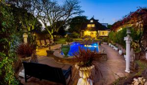 a house with a swimming pool in a yard at Forest Hall Guest House in Port Elizabeth