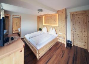 Letto o letti in una camera di Sagritzerwirt