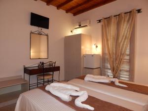 Posteľ alebo postele v izbe v ubytovaní Nisiotiko house in Tinos near the beach
