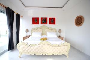 Rúm í herbergi á Vanilla Suite Jimbaran