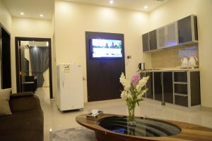 A kitchen or kitchenette at Gardenia Furnished Units