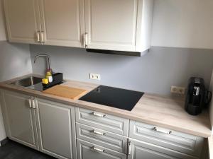 a kitchen with a sink and a counter top at Ferienwohnung "am Ochsentor" in Andernach