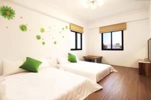 Postel nebo postele na pokoji v ubytování Zih Yue Tong Homestay II