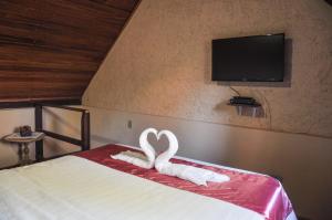 Cama ou camas em um quarto em Castelar da Alvorada