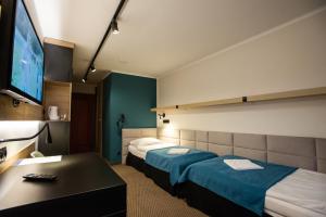 Postel nebo postele na pokoji v ubytování Hotel Halo Szczyrk