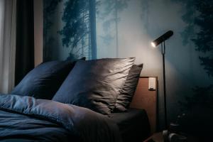 Postel nebo postele na pokoji v ubytování Urbn Dreams III