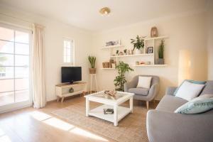 Uma TV ou centro de entretenimento em Villa Lena
