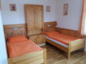 Posteľ alebo postele v izbe v ubytovaní Penzion Ve Staré škole