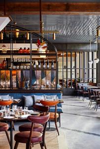 a restaurant with tables and chairs and a bar at The Blake Hotel in New Haven