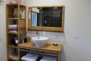 a bathroom with a sink and a mirror and towels at "Mi-a-clo" in Cucq +17 photos