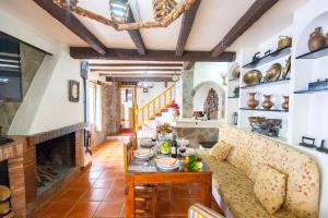 a living room with a fireplace and a couch at Hacienda El Molino in El Bosque