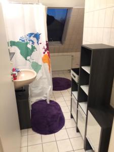 a bathroom with a toilet and a sink and a shower at Rilke in Markkleeberg