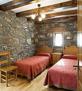 Postel nebo postele na pokoji v ubytování Apartamentos Casa Buisan