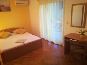 Postel nebo postele na pokoji v ubytování Apartments 2D