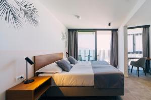 Postel nebo postele na pokoji v ubytování MORENIA All Inclusive Hotel