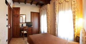 เตียงในห้องที่ Agriturismo Delizia d'Este