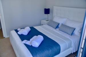 Säng eller sängar i ett rum på Amora Villa Sacha