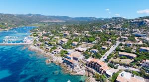 an aerial view of a resort next to the ocean at Hôtel du Golfe in Sartène +17 photos