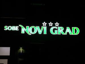 a neon sign that says salsa now grand at Sobe Novi grad in Osijek