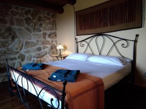 Postel nebo postele na pokoji v ubytování Villa Siciliana con piscina e vista panoramica sul mare + 37 fotografií