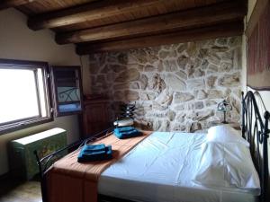 Postel nebo postele na pokoji v ubytování Villa Siciliana con piscina e vista panoramica sul mare