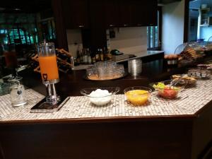 a counter with bowls of food and a blender on it at Spanias Hotel in Kalabaka