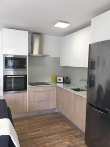 Kuchyňa alebo kuchynka v ubytovaní Esmeralda Apartment