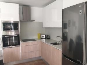 Kuchyňa alebo kuchynka v ubytovaní Esmeralda Apartment