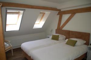 Un pat sau paturi într-o cameră la Bed & Breakfast Appeltern