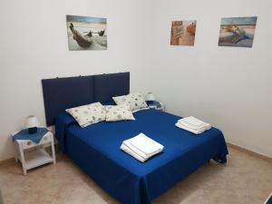 Postel nebo postele na pokoji v ubytování Punta Grande - Scala dei Turchi