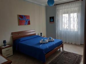 Posteľ alebo postele v izbe v ubytovaní La Casa del Sole