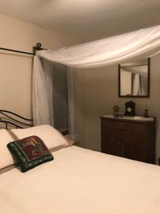 
a bedroom with a bed and a lamp at Mill Stone - Mt Penn Lodging in Mount Penn
