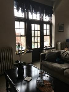 
a living room filled with furniture and a window at Mill Stone - Mt Penn Lodging in Mount Penn
