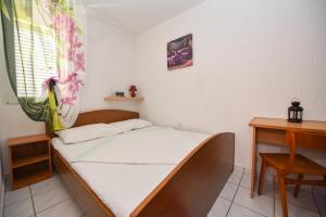 Postel nebo postele na pokoji v ubytování Apartment TinaTeo, Gajac