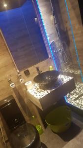 a bathroom with a sink and a mirror at myHome in Gießen +22 photos