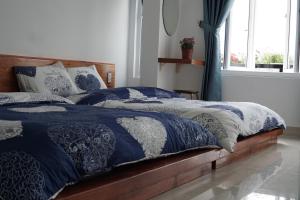 Postel nebo postele na pokoji v ubytování Ha Khoa Hotel Dalat
