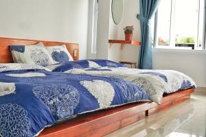 Postel nebo postele na pokoji v ubytování Ha Khoa Hotel Dalat