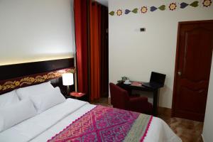 Postel nebo postele na pokoji v ubytování Altipacha Ayacucho Hotel
