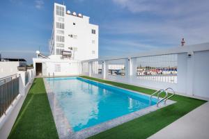 a swimming pool on the balcony of a building at Phuc Ngoc Hotel in Ap Rạch Soi
