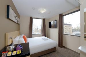 Postel nebo postele na pokoji v ubytování ibis Budget - Melbourne CBD