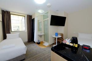 Postel nebo postele na pokoji v ubytování ibis Budget - Melbourne CBD