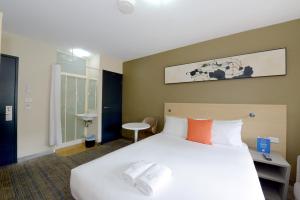 Postel nebo postele na pokoji v ubytování ibis Budget - Melbourne CBD