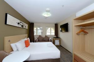 Postel nebo postele na pokoji v ubytování ibis Budget - Melbourne CBD