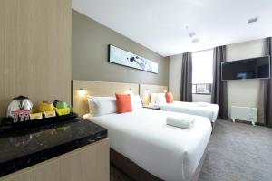Postel nebo postele na pokoji v ubytování ibis Budget - Melbourne CBD