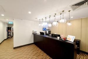 a large room with a large counter top at ibis Budget - Melbourne CBD in Melbourne