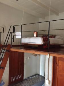 a room with two bunk beds on top of a building at Hostería de Río - C92 in Gutiérrez Zamora