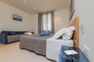Postel nebo postele na pokoji v ubytování B&B Adduari